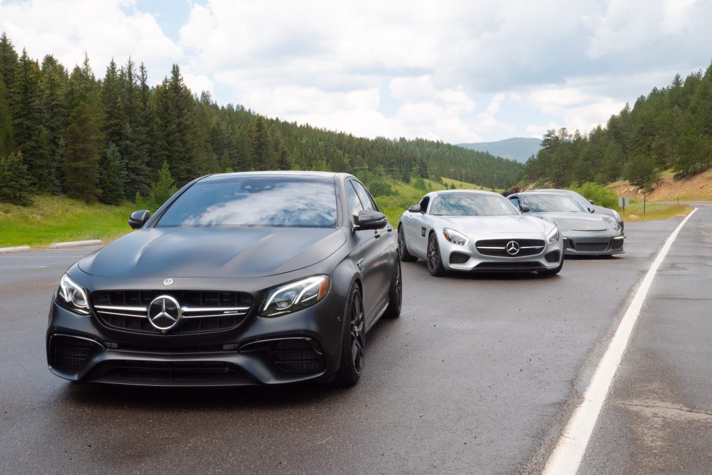 Luxury mercedes cars parked on an open tar area